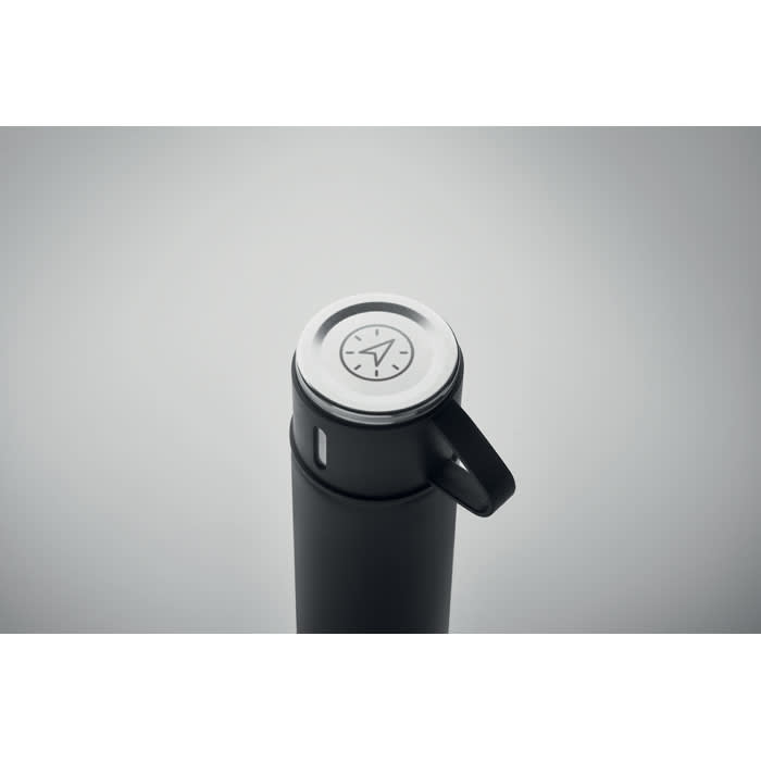 A drink bottle in matte black with a white lid featuring a clock design and a handle.