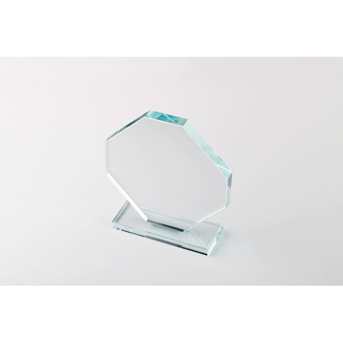 A clear glass award with an octagonal top, mounted on a rectangular base.