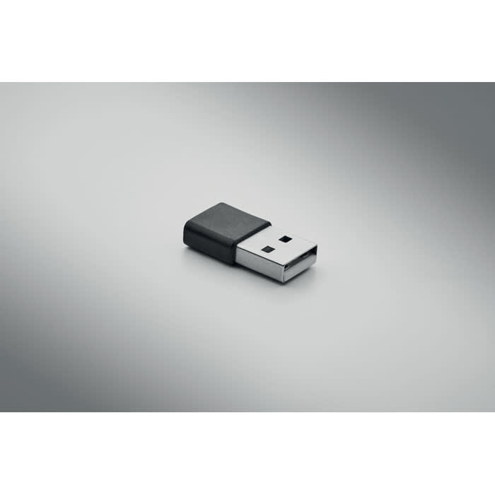 A USB flash drive with a black and silver design, featuring a simple rectangular shape.