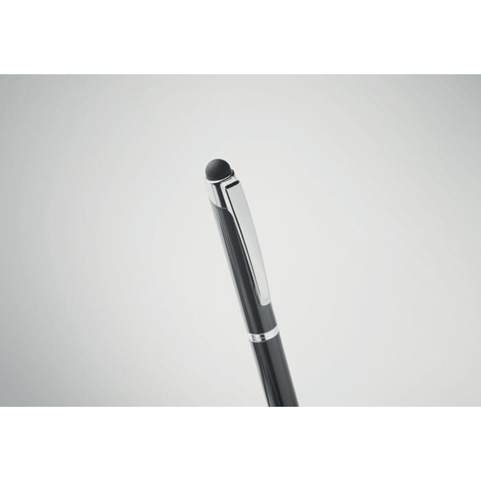 A black pen with a silver clip and a stylus tip, set against a light grey background.