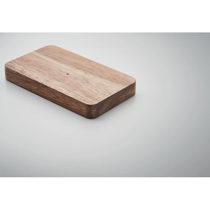 A wooden serving board with a smooth surface and rounded edges, featuring a natural wood grain pattern.