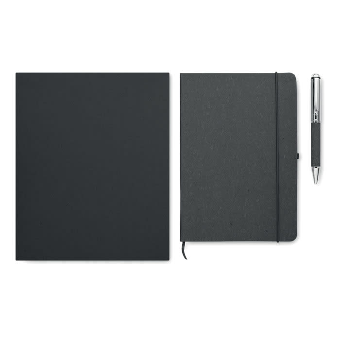 A dark grey notebook with an elastic band, accompanied by a silver pen. A second plain dark grey cover is nearby.