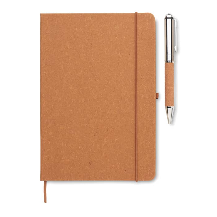 A tan notebook with a textured cover and an elastic band, accompanied by a silver pen.