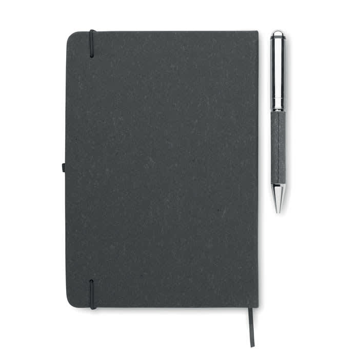 A grey notebook with a pen resting beside it, featuring a logo on the cover.