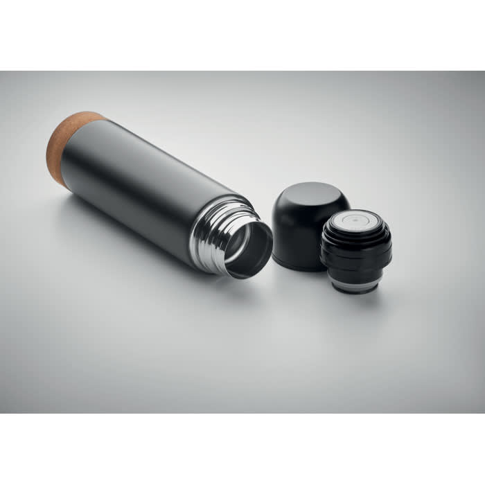A drink bottle in matte black with a wooden top and a removable black cap beside it.