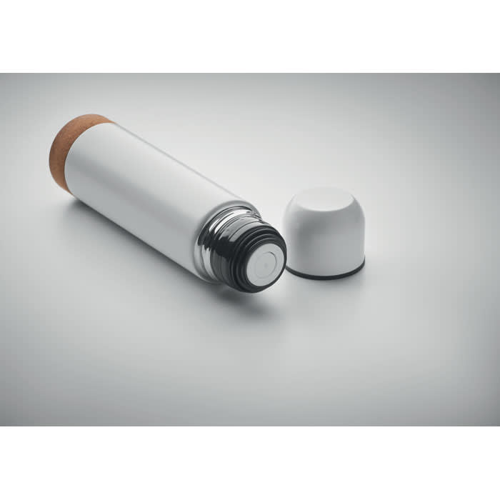 A drink bottle in white with a black and silver base, featuring a cork top and a removable lid.