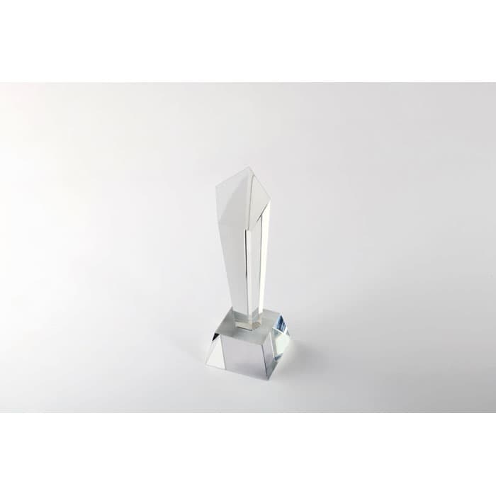 A crystal trophy with a geometric design featuring a clear, glossy finish and a square base.