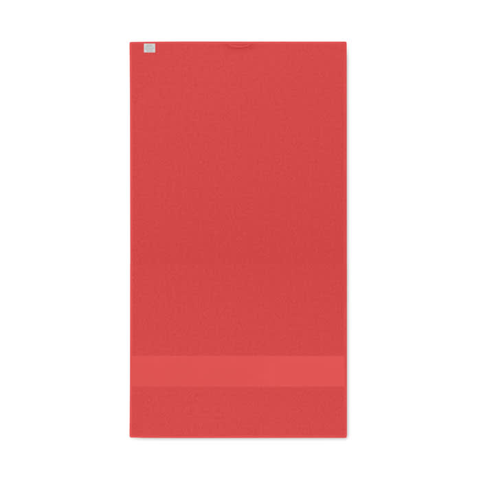 A red drink bottle with a smooth surface and a small logo at the top.