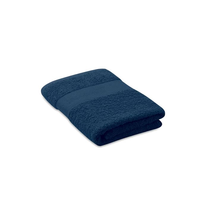 A dark navy bath towel, neatly folded, featuring a textured stripe design. The towel has a soft, plush appearance.