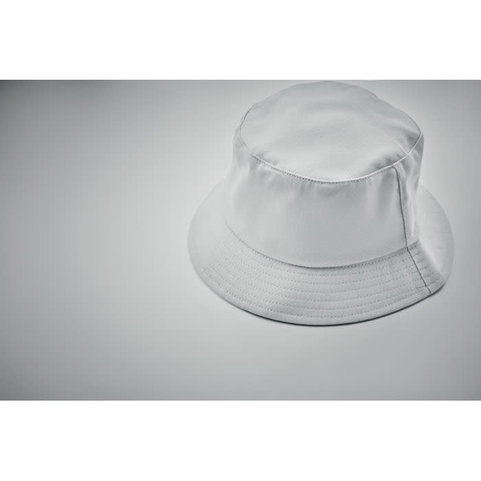 A white bucket hat featuring a smooth fabric and a wide brim, positioned on a light background.