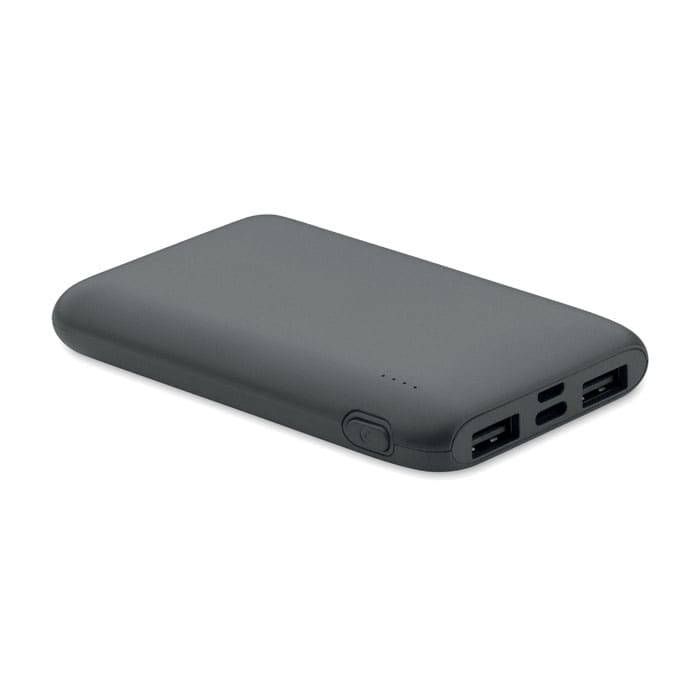 A power bank in matte black, featuring multiple USB ports and an LED power indicator.