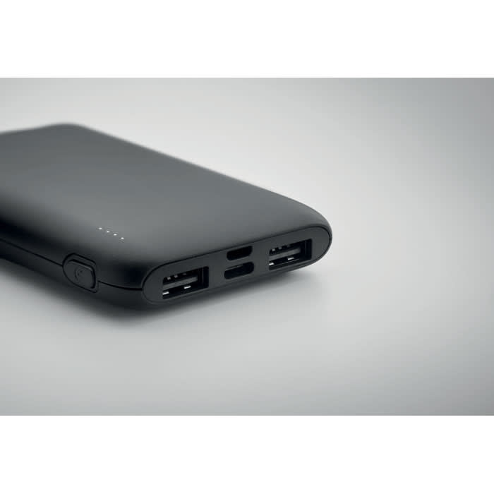 A black portable power bank with multiple USB ports and a battery level indicator.