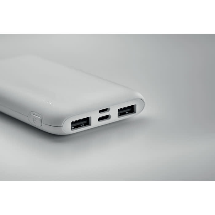 A power bank in white with multiple USB and USB-C ports for charging devices. It has a smooth, sleek design.