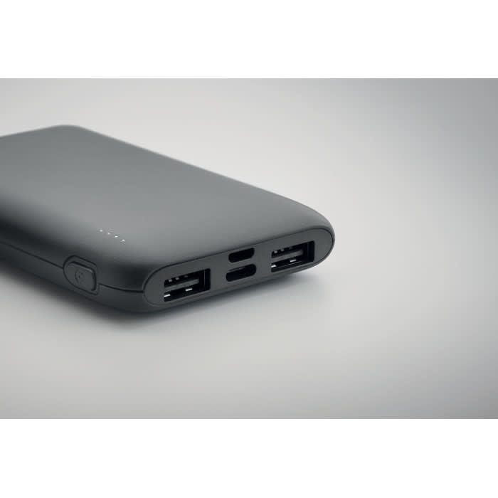 A power bank in sleek black with two USB ports and a USB-C port, featuring a minimalistic design.