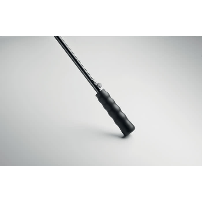 A black walking stick with a textured grip and a metal shaft, featuring a slight bend near the handle.