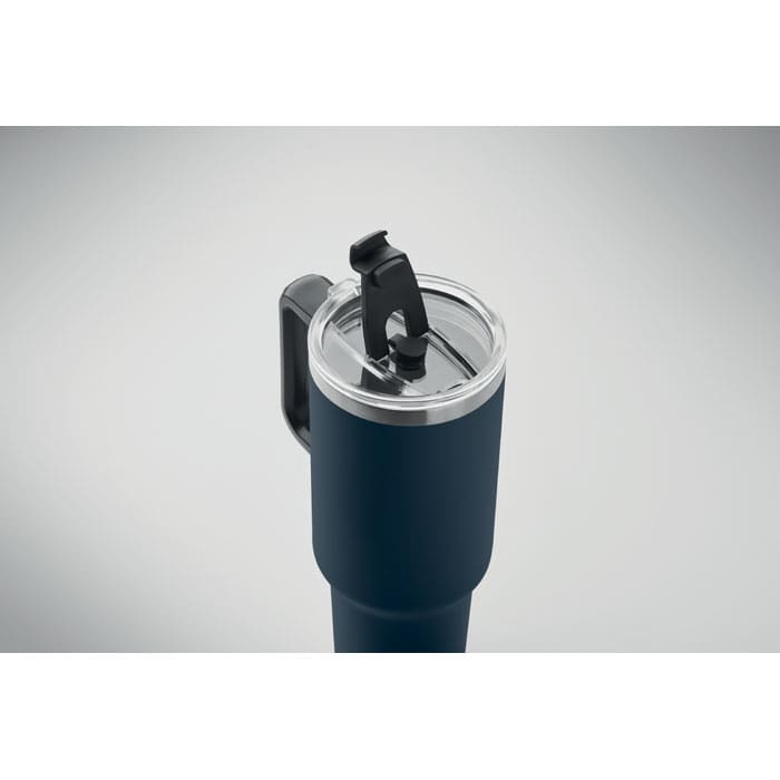A drink bottle in navy blue with a clear lid and a black flip-top spout, featuring a handle.