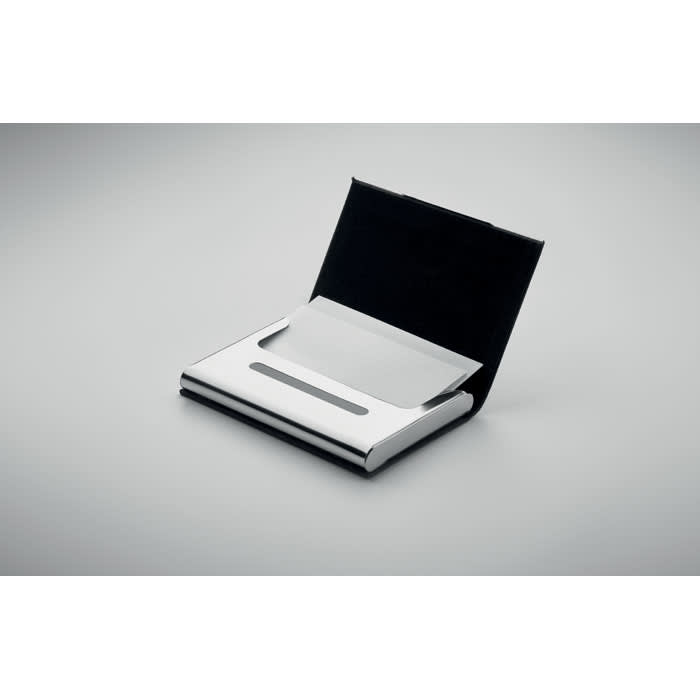 A sleek silver business card holder with a black fabric backing, featuring a simple, minimalist design.