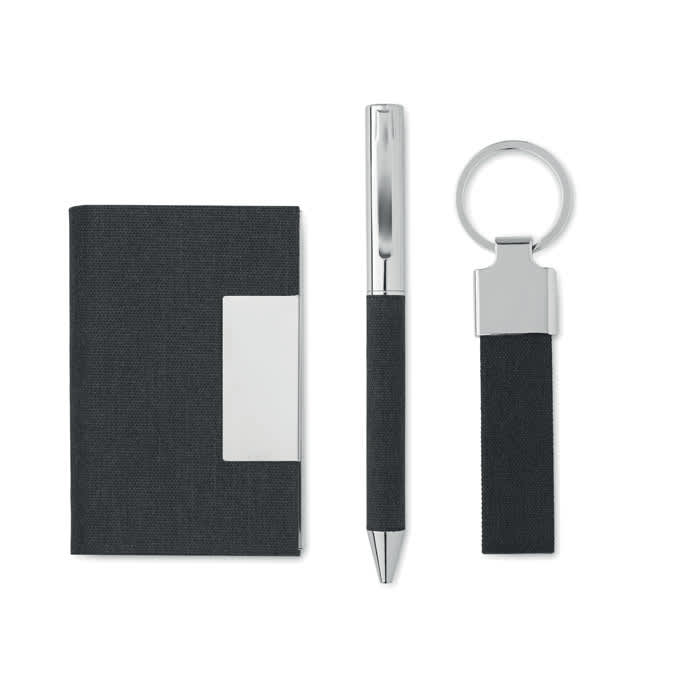 A black notebook, silver pen, and keyring, all featuring a sleek and modern design. The set has a minimalist aesthetic.