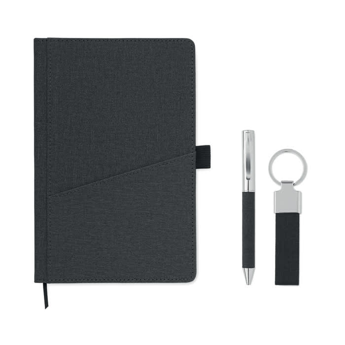 A dark grey notebook with a pen and a keyring attached, featuring a subtle textured design.