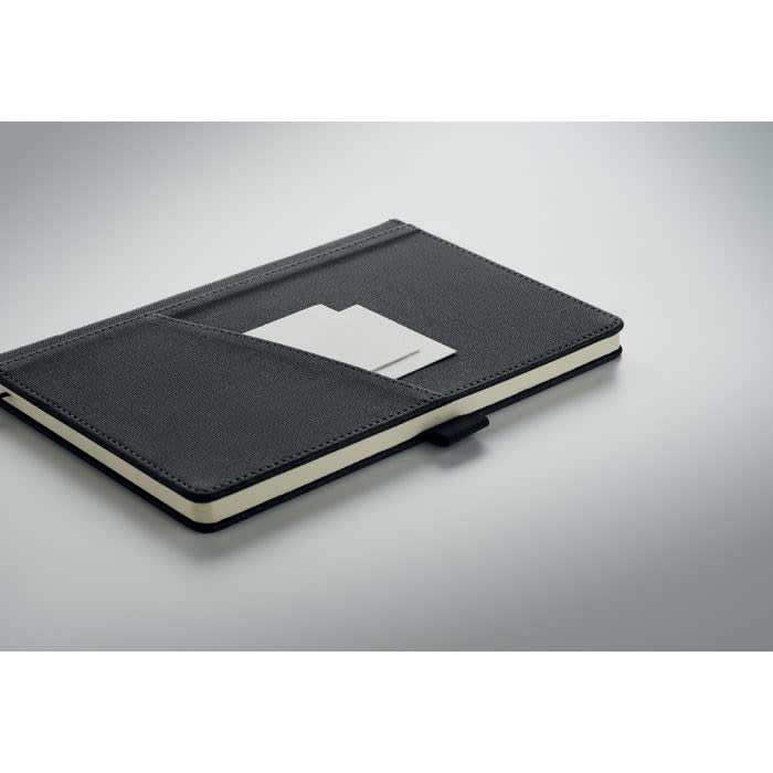 A black notebook with a textured cover, featuring a card pocket and a button closure.