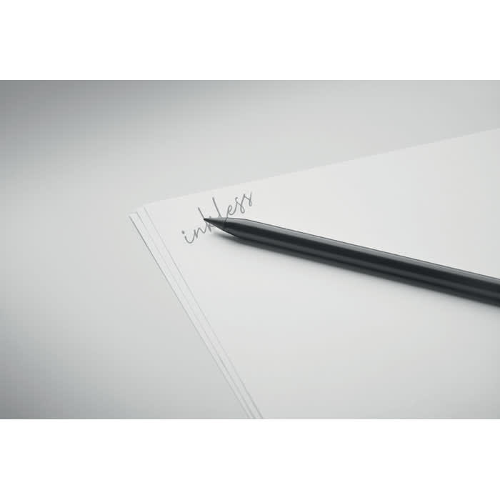 A sleek black pencil rests on a stack of blank white papers featuring the word "unless" written in elegant cursive.