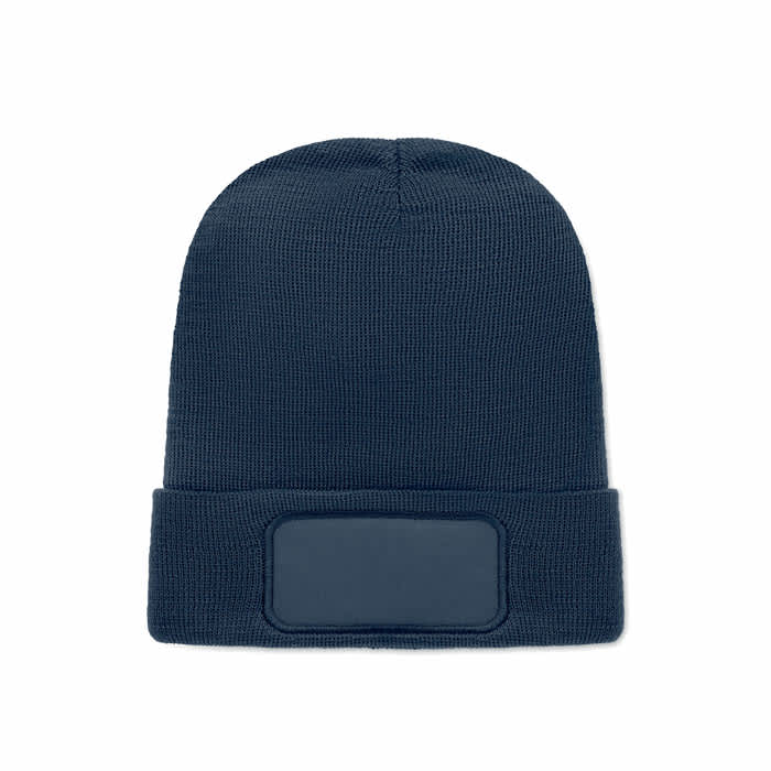 A navy blue beanie hat with a textured design and a blank patch for branding or personalisation.