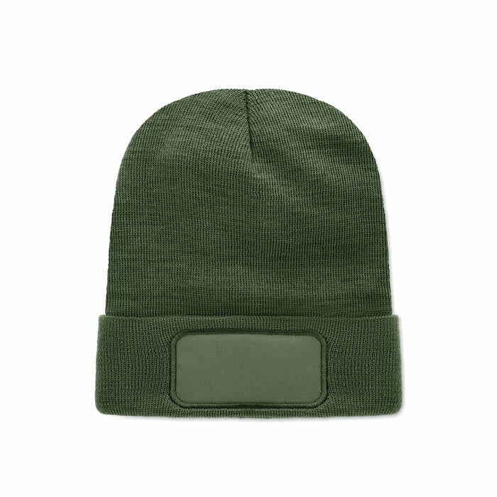 A green beanie featuring a fold-over cuff and a blank patch on the front for customisation.