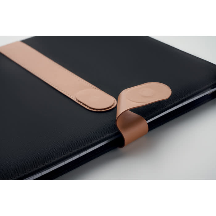 A notebook with a black cover and a tan elastic band closure. It features a smooth, sleek design.