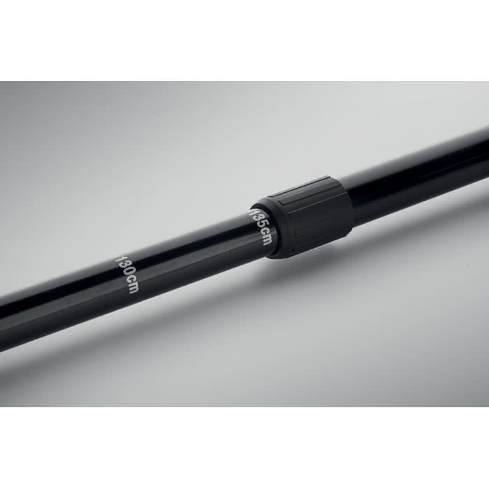 A black adjustable pole featuring measurement markings, with a twist lock mechanism for securing height.