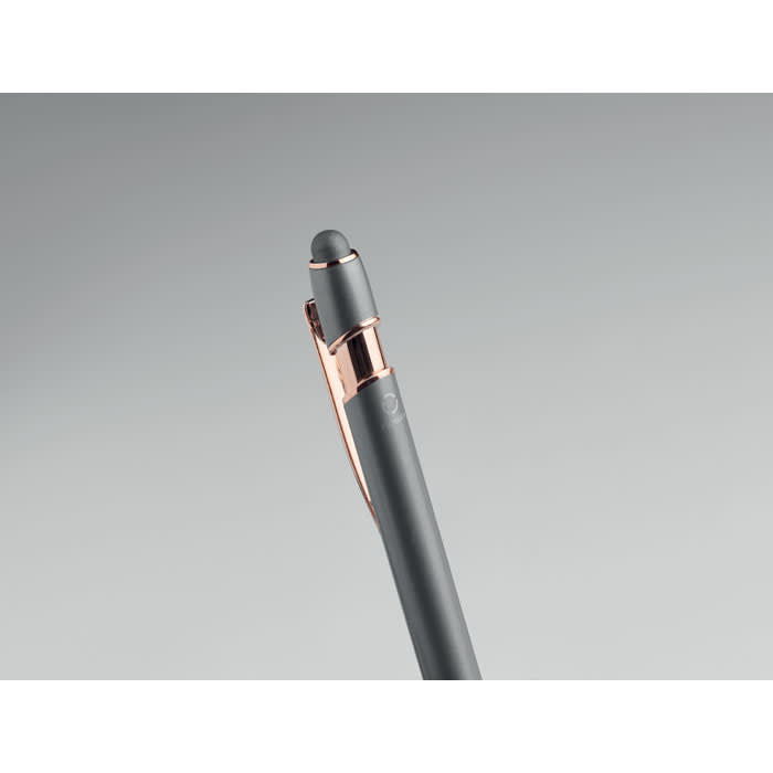 A grey pen with a rose gold clip and a stylus tip, featuring a sleek design and a logo on the clip.
