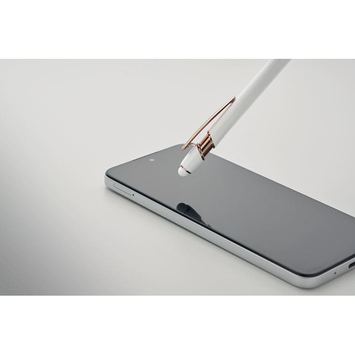 A white pen with a rose gold clip is poised above a sleek black smartphone.