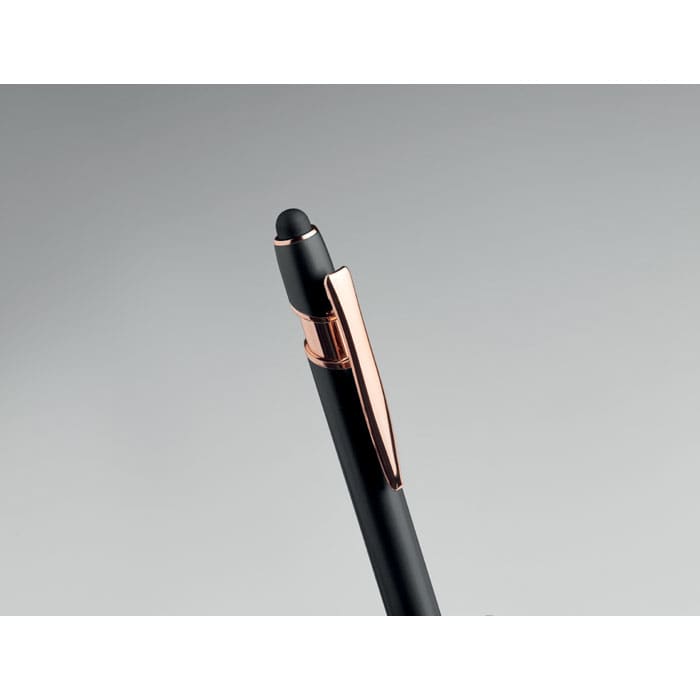 A black pen with a rose gold clip and a rounded tip. It features a logo on the body.