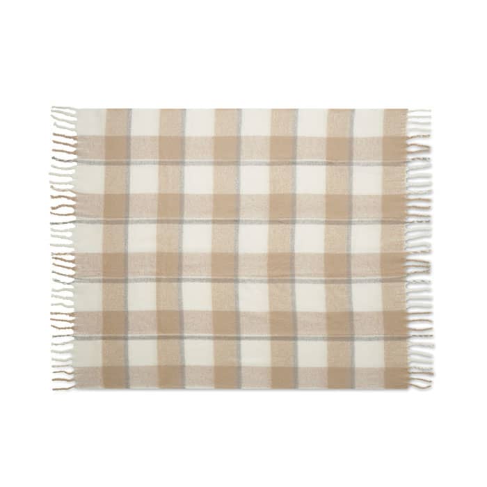 A patterned blanket featuring a beige and cream plaid design with fringed edges.