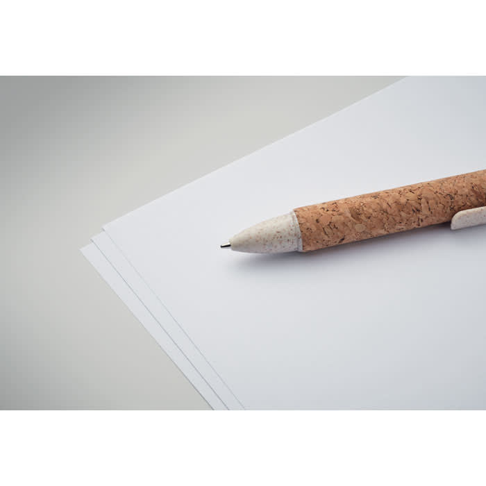 A cork-handled pen rests on a stack of blank white paper, showcasing a minimalist stationery setup.