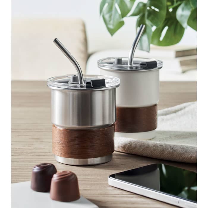 A drink bottle set featuring stainless steel and white finishes, with brown leather sleeves and reusable straws.