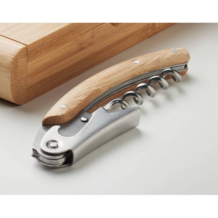 A corkscrew with a wooden handle and stainless steel lever, resting on a neutral background.