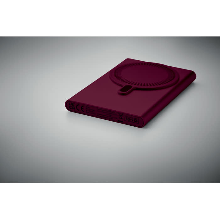 A drink bottle in a deep burgundy colour with a circular design and a small opening. It features a logo.