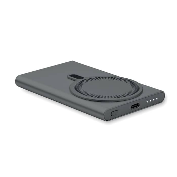 A portable charger in dark grey with a circular design and four indicator lights, featuring a USB-C port.