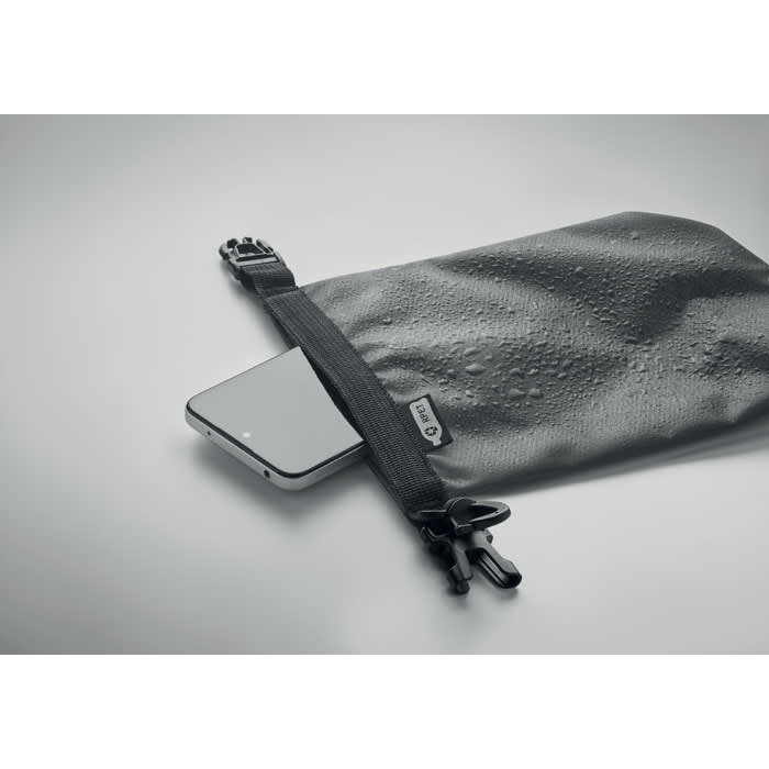 A waterproof black pouch with a zipper, containing a smartphone, resting on a smooth surface.