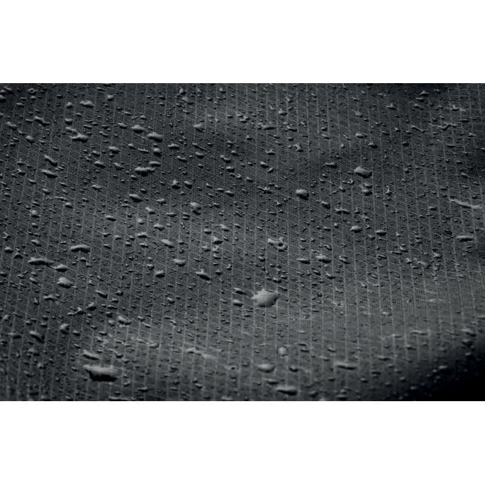 A textured black surface with water droplets, showcasing a water-resistant material. It features a subtle pattern and sheen.