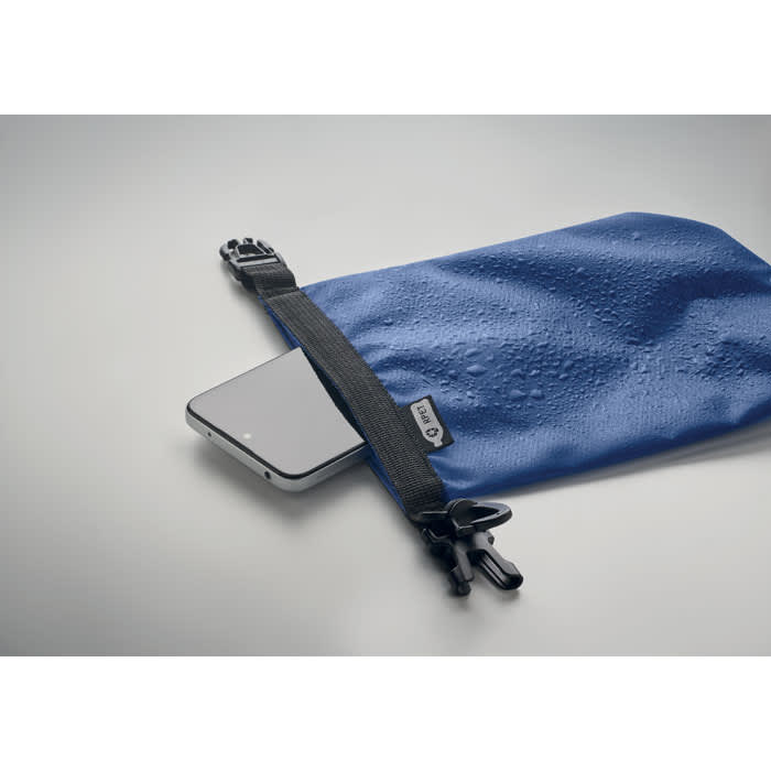 A waterproof blue pouch with a zipper, housing a smartphone, featuring a small black clip and branding.