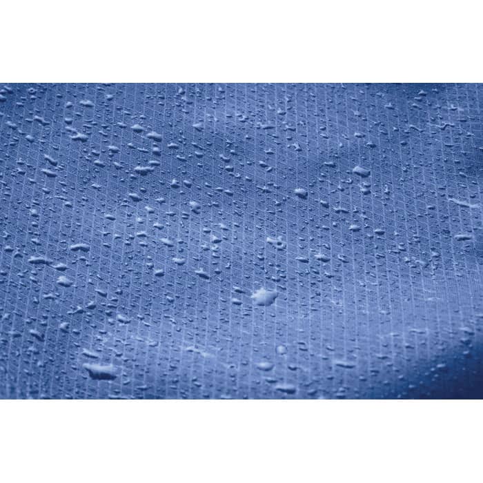 A textured blue surface with water droplets scattered across it, featuring a subtle pattern.