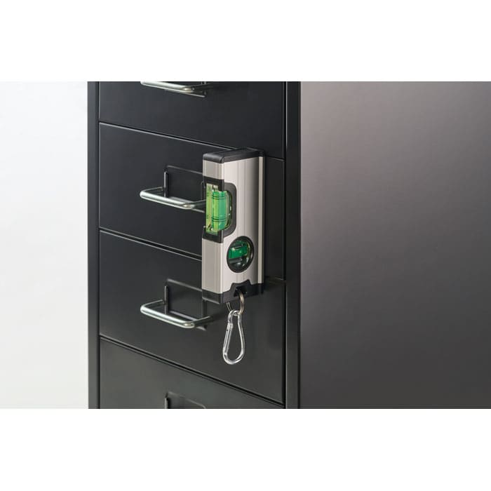 A smart lock attached to a black filing cabinet, featuring a green indicator light and a keychain attachment.