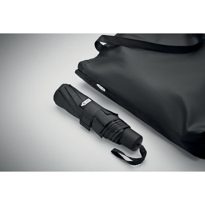 A black folding umbrella and a matching black carry bag, both featuring a logo.