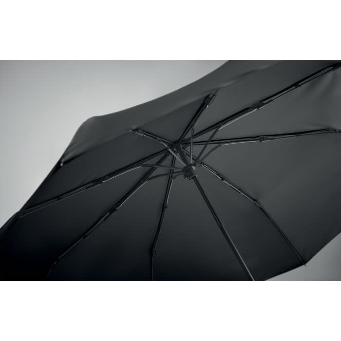 A black umbrella with a sleek design and a sturdy frame, featuring a visible structure of ribs and spokes.