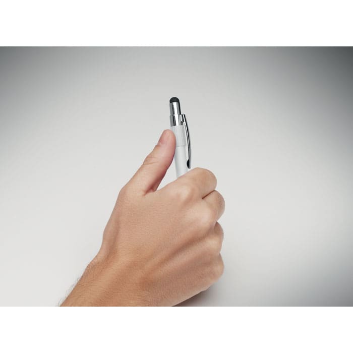 A white stylus pen held in a hand, featuring a shiny silver clip and tip.