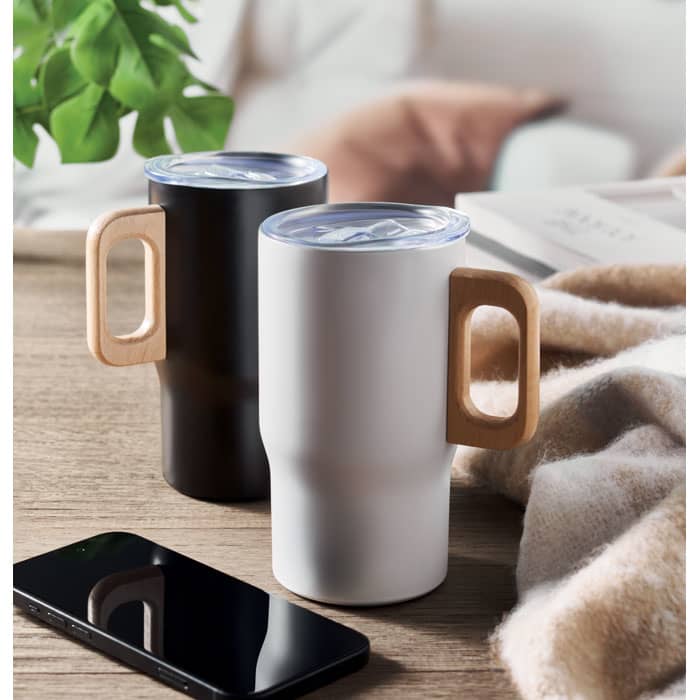 A drink bottle set featuring a black and a white mug with wooden handles, placed on a table beside a smartphone.