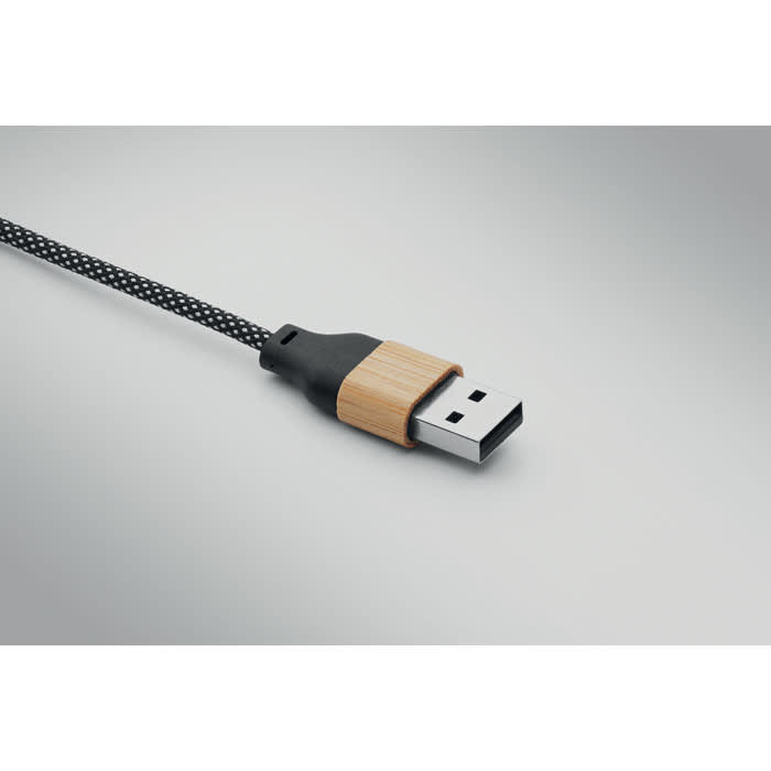 A USB cable with a woven black cord and a wooden accent on the connector.