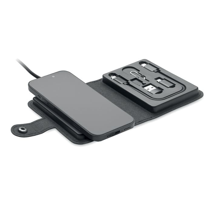 A wireless charging pad in black, featuring a mobile phone and compartments for various charging cables.