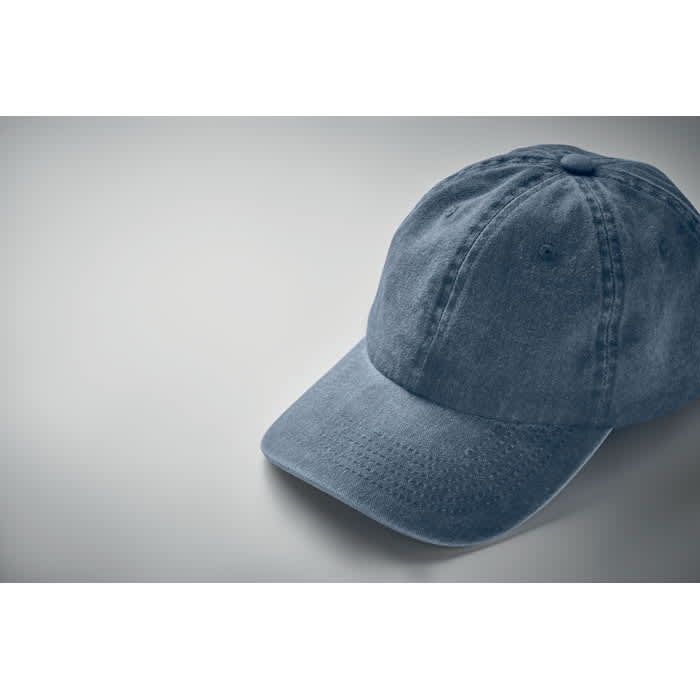 A blue cap with a curved brim and six-panel design, featuring stitching details and a logo.
